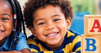 Smiling preschool children beside a stack of alphabet building blocks